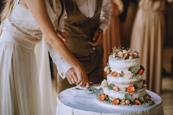 cutting a wedding cake